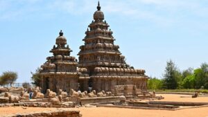 Ancient Shore Temple in Mahabalipuram, India, captured in daylight with clear blue sky.